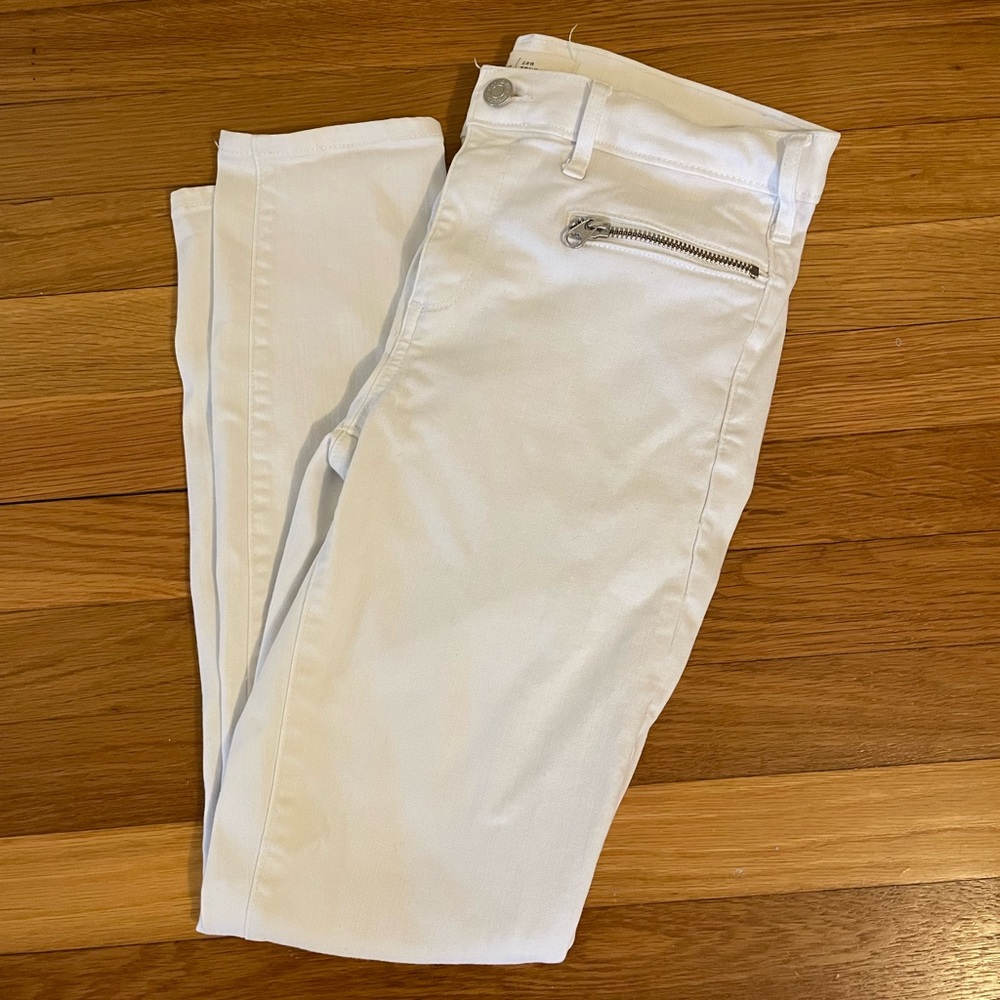 White skinny jeans with zipper detail.